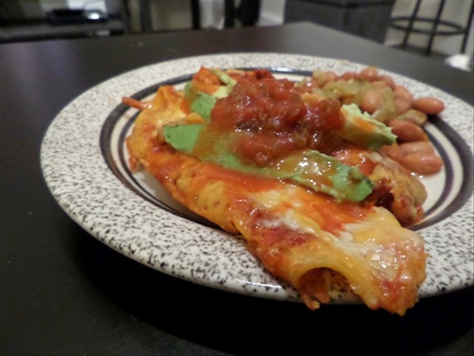 Close-up of enchiladas on a plate.