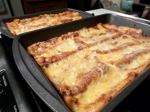 A pan of enchiladas after being cooked.