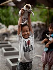 It's the irony of this shot that makes me laugh. He's a local boy, in a small village near Ubud yet he's wearing a t-shirt designed for a tourist. Clearly not shy around strangers he held his newest friend highly above his head and flashed a huge smile. The people of Bali are all like this boy, friendly and smiley! : by kurst22, Views[350]