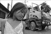 SENSE OF HEARING. A young girl on the street of Payatas—a slum area in urban Quezon City—hears the bell of an incoming dump truck. This is a signal of an arrival of a 
new bunch of 'treasure' – a pile of garbage which is a probable source of their 
meals for the day. Families earn money by selling items to nearby junk shops.: by kurtzky, Views[1546]
