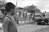 SENSE OF SIGHT. Before finally disposing of the trash in the dump site, garbage 
trucks momentarily halt in front of some houses along the road. This gives the 
residents a chance to jump onto the truck and randomly collect any rubbish. A young 
boy looks at the open tailgate and possibly asks himself, 