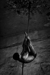 I spend a week documenting the lives of these kushti wrestlers in Mumbai in 2011. I went back last year for another week to work again on the story. 

The men live their lives according to ancient old rules and diets. The conditions they live in are very simple. 

The light conditions were quite though as light came only in via two small windows. All images though were made hand held and without the use of flash!

Climbing a rope upside down. Showing extreme strength and control over the b: by kushti, Views[747]