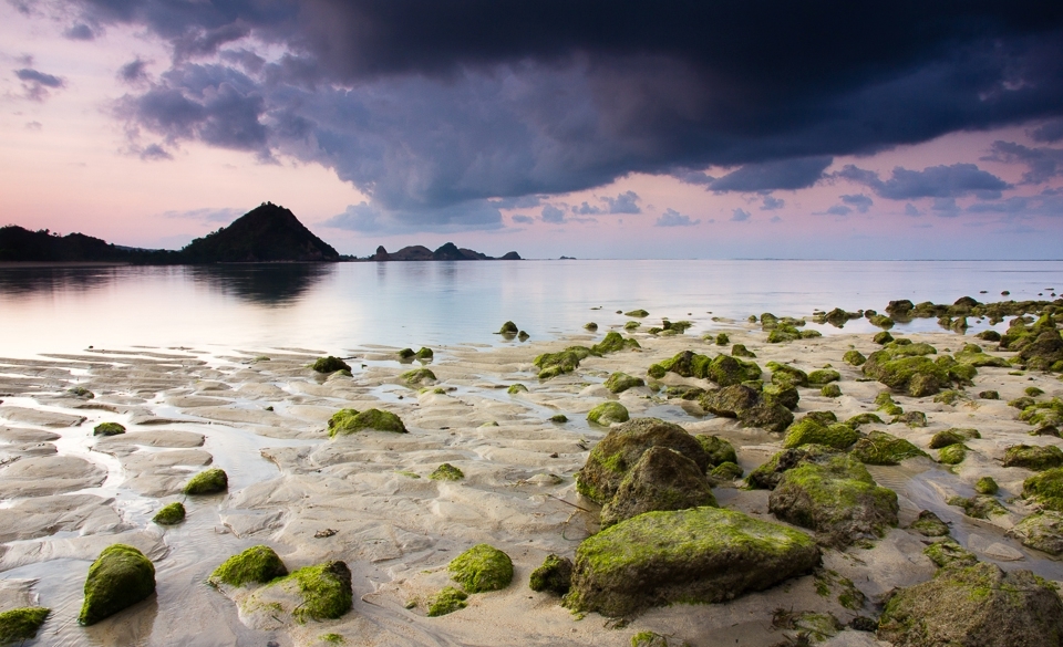 Powerful, enigmatic, green and rocky… the hill battles against the defying sky. 