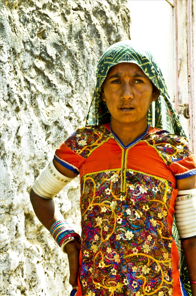 The photo shows a traditionally dressed kutch woman.