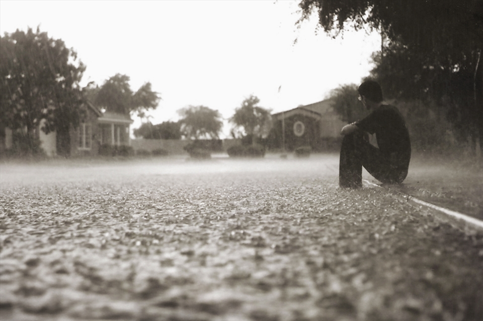 A summer hurricane floods the street.