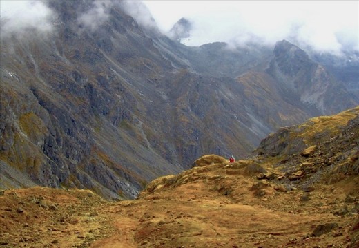 Mint Hut: Surrounded by snowy peaks and jagged slopes the Mint Hut sits on a mossy field in the distance. Built in 1971 and maintained by the Mountaineering Club of Alaska the hut allows members a base camp for a multitude of outdoor activities or visitors can simply relax and enjoy the solitude of the surroundings.