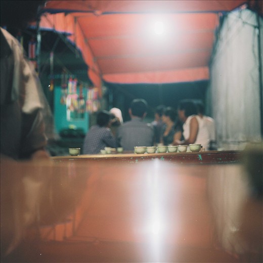 At a wake in Ha Long, a moment of mourning contrasted with celebration