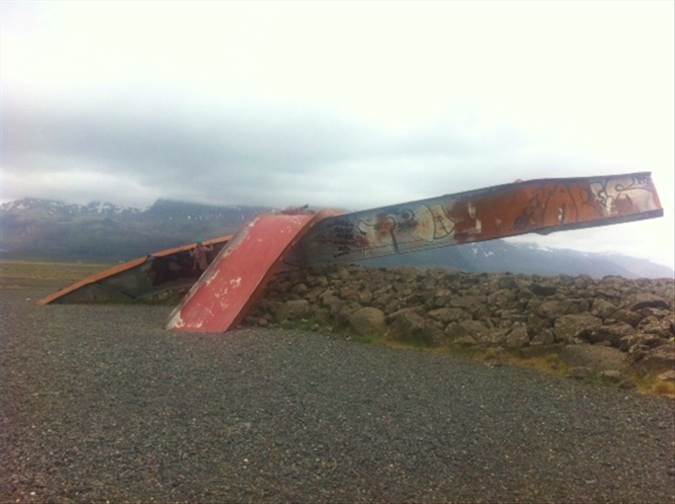  In Vatnajokull National Park, Iceland, one can go many kilometers without seeing a single soul. A sign on the side of the road tells the story of a massive flood that occurred from a volcanic eruption underneath a glacier which sent  water pouring through the valley. This is all that remains of a bridge that once functioned many kilometers upland from where its pieces are now strewn in desolate, isolation. The graffiti and vivid red was stunning against the stark landscape. 