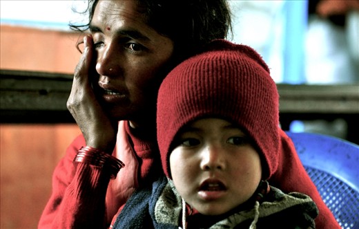 A young Nepalese mother expresses her emotion on camera about the abuse she suffers from her husband. She is forced to hide her small income and sneak out with her children in order to work and feed them.