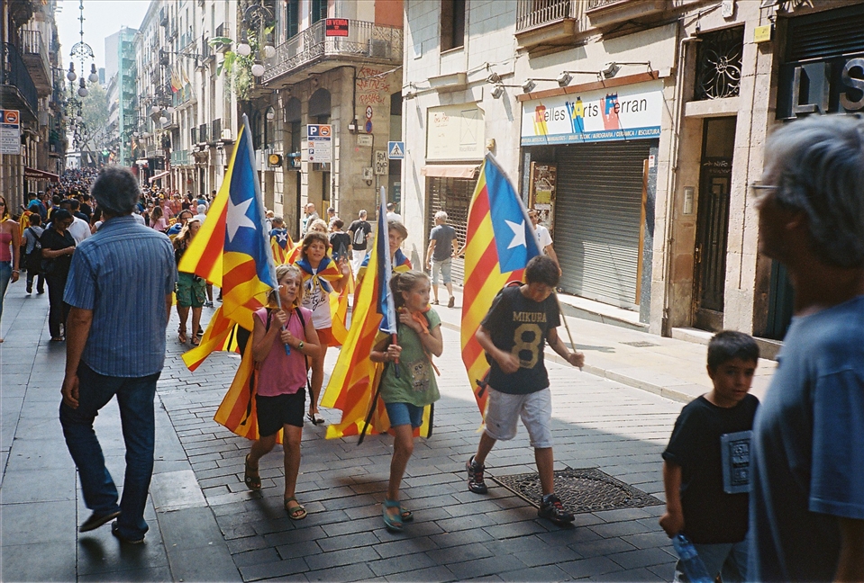 Children lead the charge from Las Ramblas to Government House on Catalonia Day.
