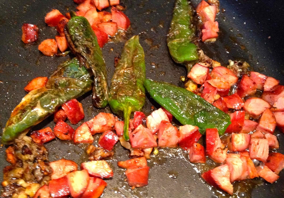 blistered peppers, chorizo, garlic in olive oil