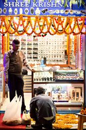 Lights, garlands and worship are some of the integral parts of Tihar. Like many, a man creates an altar in front of his store using multicolored powders, incenses or flowers among other things.: by lagrab, Views[511]