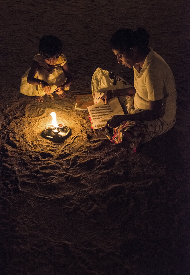 From One Generation to Another-
The Faith is passed on from generation to generation, from mom to daughter. The faith is to overcome the life's hardship. As they sit on the 'Rough Sand' and pray for the Light at the end of the tunnel. A beautiful pattern is created on the 'Rough Sand' itself by the light.  As if, beauty of Life is also about overcoming the challengers.