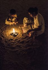 From One Generation to Another-
The Faith is passed on from generation to generation, from mom to daughter. The faith is to overcome the life's hardship. As they sit on the 'Rough Sand' and pray for the Light at the end of the tunnel. A beautiful pattern is created on the 'Rough Sand' itself by the light.  As if, beauty of Life is also about overcoming the challengers.: by lahirud, Views[545]