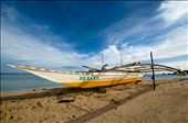 a banca boat is docked on the shores of Pandanon Island in the Philippines.: by lain, Views[310]