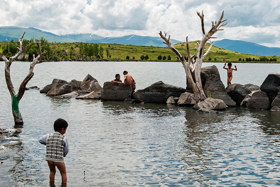 Despite the dangers of swimming here, the lake represents a playground for children during the summer.
