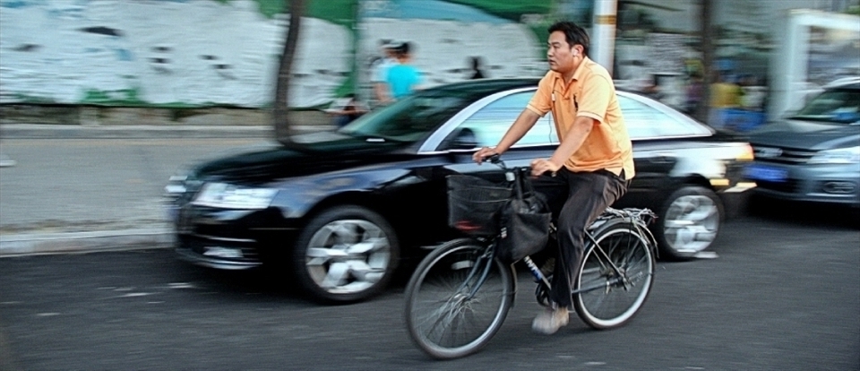 Anyone who has ever visited or lived in China would be hard pressed to imagine China without cyclists weaving in and out of the traffic. The bicycle is one symbol of China's ever changing relationship with the west. When bikes first made their appearance in China  they were welcomed with no more than apprehensive acceptance as a western oddity, now  however they are as common as chopsticks and rice. 