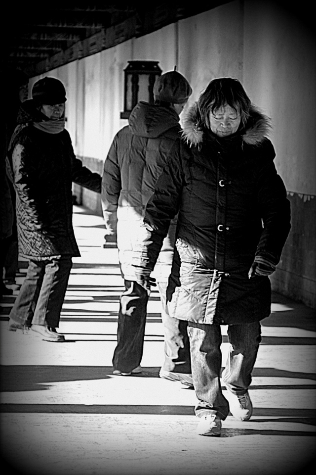One of the most remarkable things I had the pleasure of observing while I was in China was the sense of community, especially in the older generations. I took this photo of a woman just finishing an exercise dance routine with the women in the background. It was a rather cold and windy day, yet with that look of contentment on her face she could have been someplace much warmer. It is a growing fear in China, much like in many other parts of the world, that as a result of technological progress, these communal ties will not be passed on to the next generation. 