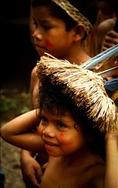 The youngest boy, the most playful of the three, eagerly tries on the headdress while his mother isn't looking.: by larachristie, Views[510]