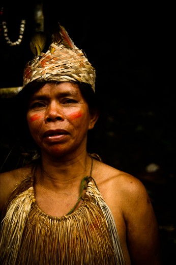 Chief's wife and the mother of the boys, wearily watches over the them from the door of the village hut. Before the boys learn to hunt, the women teach them how to make crafts for sale and trade.