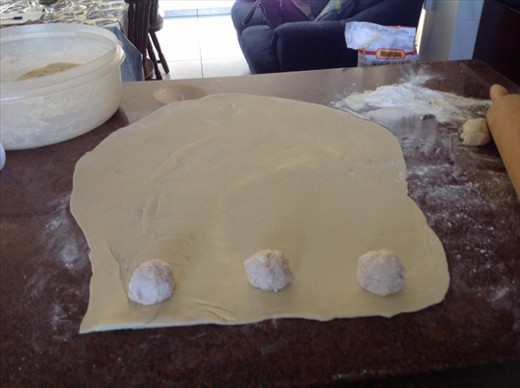 The bourekia are cut and pressed down on the sides with a fork