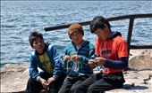 Knitting boys on Taquile - mixture of traditional and modern. There are 3 rules on Taquile - don't steal, don't lie and don't be lazy. So women wave, but man knit (because it's easier than waving). Many tourists visiting the island are told about the traditional customs and offered to buy the knitwear although not all locals wear the traditional clothing. It's a stick with two ends - differences make travelling more interesting, but everyone on Earth must also have equal oportunities and comfort.: by laste, Views[652]