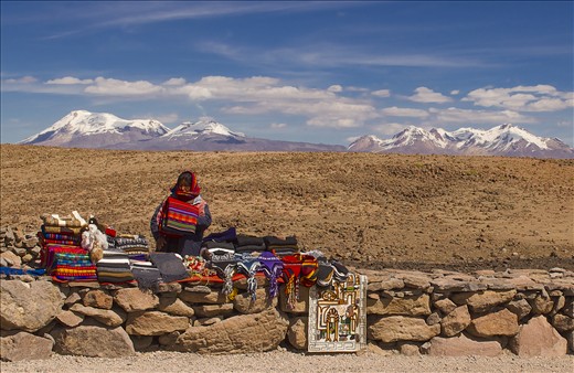 Southern Peru. Nothing for miles, except for Hualca Hualca volcano (6,025 metres) in the distance, but this lady was still braving the freezing conditions to earn some money for her family