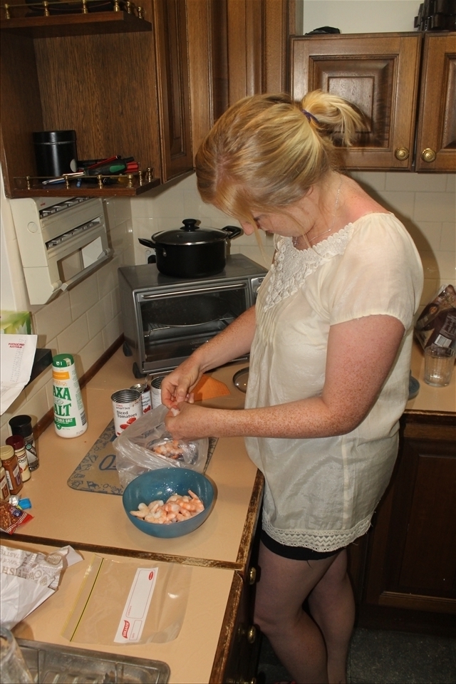 Peeling the prawns.