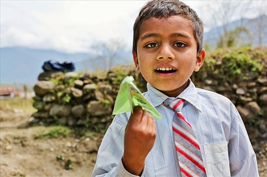 A paper plane prepares for flight in this Lahachowk mountainside school in Nepal. Rocky stone walls and mist covered mountains provide plenty of opportunities for paper-planes to go missing mid-flight.