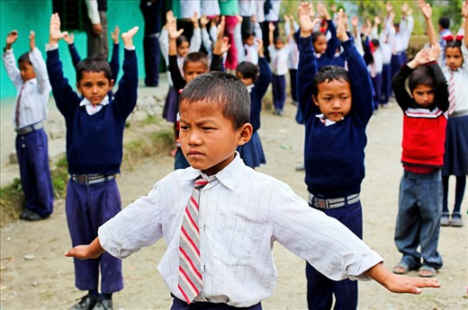 Morning exercises led by a solemn and focused seven year old boy. Every day a different student leads their Kent College Nepal peers in ten minutes of exercise and stretching before class begins.