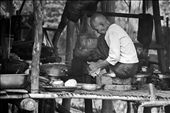 Most women spend the day inside the home cooking and doing daily chores, such as this nun preparing some coconut milk for lunch. : by lauranc, Views[357]