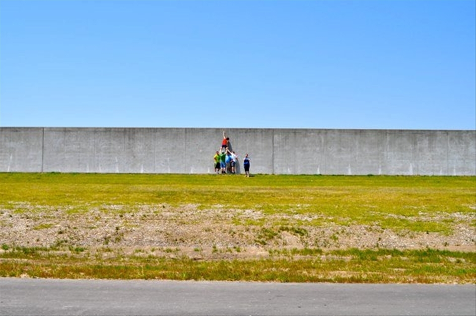 After the devistation of Hurricane Katrina I volenteered to help and fell in love with the city, its people and their stories. For the past four years I have returned to work on re-building efforts. This photograph is the result of another project we took on one day, 