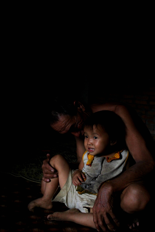 Every household in the village provided a special service. One family ran a rice-whiskey distillery, another owned a machine for de-husking rice. Luat's family grows tobacco and he spends his free time rolling endless cigarettes and doting on his grandaughter