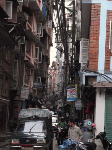 good example of the crazy narrow streets , choked with traffic, and no pavements anywhere!