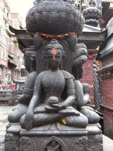 statue in a small roadside temple