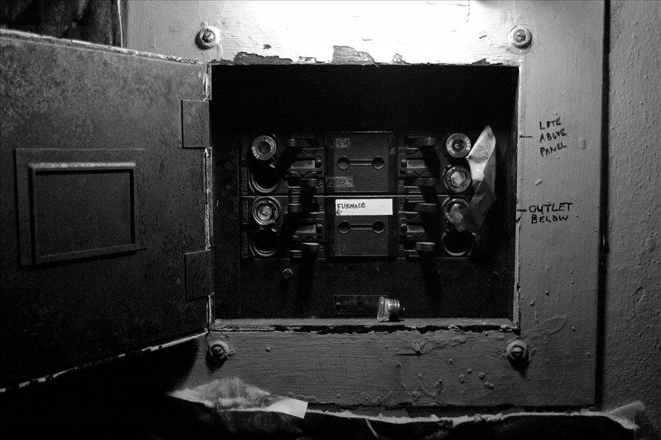 A decades-old fuse box remains open as a result of regular power failures.