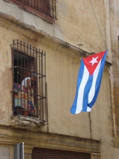 It has been fifty years since the victory of the Cuban revolution. Havana - the city and the people - do not seem to have changed much. In this picture a woman 