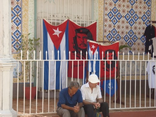 Old men sitting at a corner in Trinidad de Cuba. Elders of today were the  
revolution’s youths. Che's portraits can be found in every corner of Cuba as the  
relentless symbol of a revolution, once youthful with high aspirations. After fifty years 
do they think revolution fulfilled its promises?! Can their miens tell some answers?