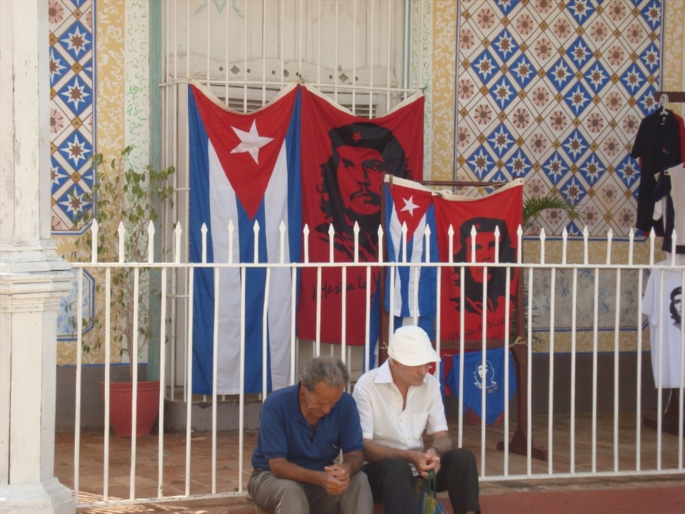 Old men sitting at a corner in Trinidad de Cuba. Elders of today were the  
revolution’s youths. Che's portraits can be found in every corner of Cuba as the  
relentless symbol of a revolution, once youthful with high aspirations. After fifty years, 
do they still think the revolution has fulfilled its promises?! Can their miens tell some answers?