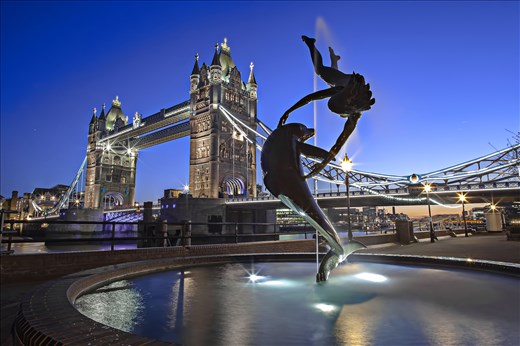 The photo is taken in London of the Dolphin and the Lady statue near Tower Bridge taken on a slow shutter speed of 30 seconds