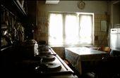The family´s kitchen - the heart of the butchery. Located next to the selling room, this is the place where stories are told - old and new. Stories about the past during their struggle to survive in world war II and present challenges - stories about cattle, about customers, about ancestors, friends or one of the 120 members of the extended family. Don´t  fool yourself - the family‘s voice is louder than this silent image might portray! There are heated talks in tidy rooms and the smell of four generations of sausage production skills…: by lena1982, Views[814]