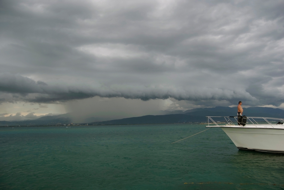 This is a white and rich man looking at the landscape from his private yacht.