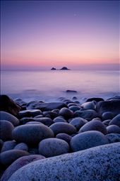 'Crescent', shot in Cornwall, The United Kingdom. This shot has a very special place in my heart. I had heard about Porth Navern in Cornwall but had never visited it before. On the day of buying my new Nikon D700 camera I headed down to this hidden bay with great hope. Not really knowing how to use this specific camera I set the D700 to it's most basic mode and attached me cable release. After a little wondering around I found this viewpoint. I wanted to document a magical moment like no other but convey a sense of perspective of life. After one of the most epic sunsets I had ever seen I was very happy. I love how the smallest element in this shot is the most influential. Without the moon the tides would not change, coastal erosion would be significantly different and the egg shaped boulders here would not exist. This is one of my most treasured photographs. : by lewisdhtolputt, Views[1108]