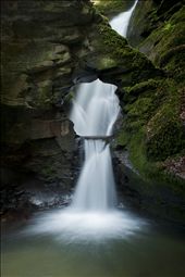 'Angel's Well', shot in Cornwall, The United Kingdom. This shot was the result of standing in icy water for over 90 minutes. I discovered this waterfall quite by chance. Hidden at the end of a long woodland walk in an overlooked valley, this waterfall is nothing short of beautiful. With only a prime lens attached to my camera, to achieve this shot I had to bear the bitterly cold spray and set up camp in the icy water. It took over an hour and a half to wait for the right cloud coverage to soften the light and paint this scene. Despite not being able to walk properly due to my feet turning a white shade of blue this photograph was worth all the effort.  : by lewistolputt, Views[136]