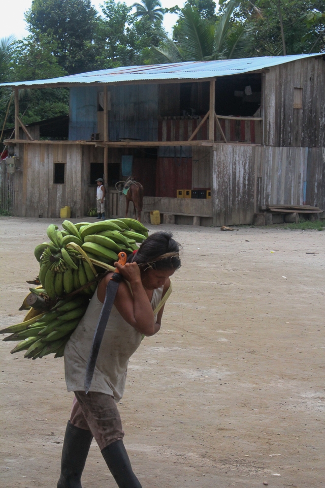 A woman works hard in her indigenous village to bring food to the table. 