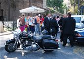 Waiting for the Bride & Groom – A Mafiosa Wedding? 
The beautiful easy ride of the Harley Davidson awaits the return of the bride and groom. Here the motorcycle is at the heart of romance in one of the most romantic cities in the world. The men waiting here are clearly watchful of all life around the bike, as well as the important couple that they’re waiting for. Are they Mafiosa? Romance is at the heart of most people’s lives in Rome. : by life-on-bikes-in-rome, Views[1259]