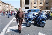 Italian Police Motorbikes in Religious Attendance at the Vatican. 
Taken in the foreground of St Peters following the Easter Speech of Benedict XVI, the motorcycle police watch the dissipation of the crowd, as people leave to go home. A family priest walks forwards towards the Vatican, reflecting on his own meeting with the Pope an hour from now. Religion is truly at the very heart of life in Rome.  : by life-on-bikes-in-rome, Views[1634]