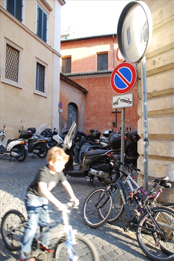 The Younger Generation & their Pushbikes – Biking is part of Family Life in Rome. Beginning on the pushbike the younger generation ride the hills of Rome until old enough to graduate to the scooters and motorbikes of their adult lives in the beautiful, Eternal City. 
