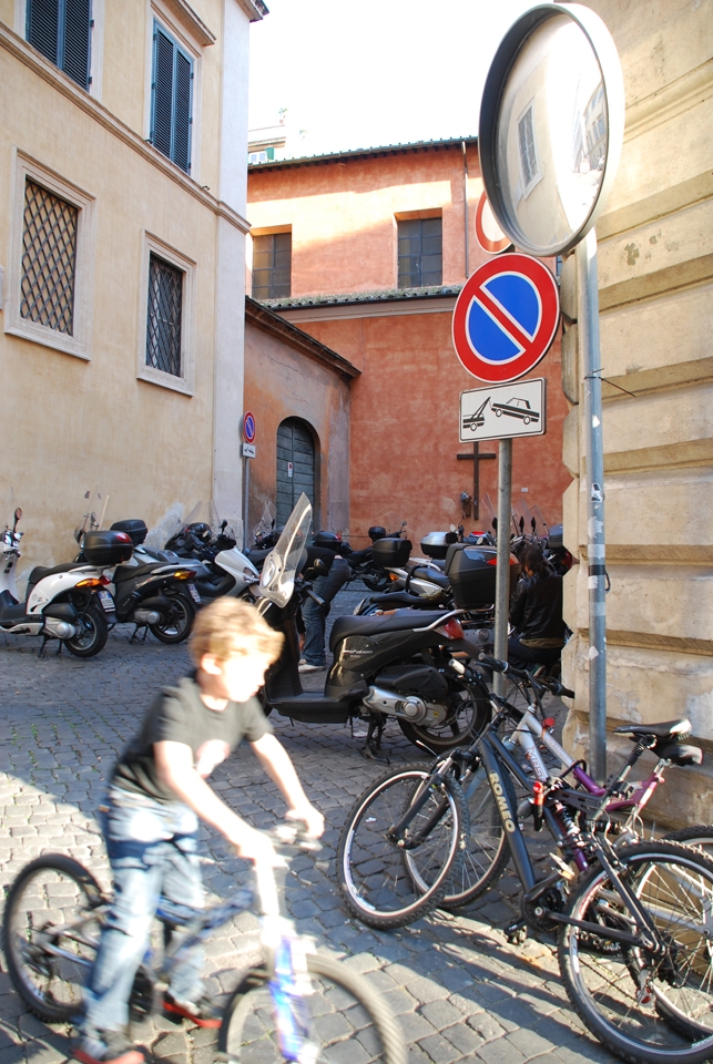 The Younger Generation & their Pushbikes – Biking is part of Family Life in Rome. Beginning on the pushbike the younger generation ride the hills of Rome until old enough to graduate to the scooters and motorbikes of their adult lives in the beautiful, Eternal City. 