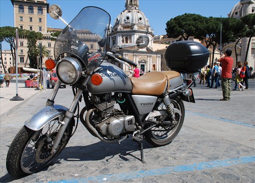 The Tourist and the Motorbike: Exploring Historical Rome. 
All roads lead to Rome and the motorbike allows the tourist to ride all of them – from the wide avenues to the narrow sidestreets that lead to it’s very heart. Tourism is integral to Rome itself, and to the lives of the people who live and adventure here. 